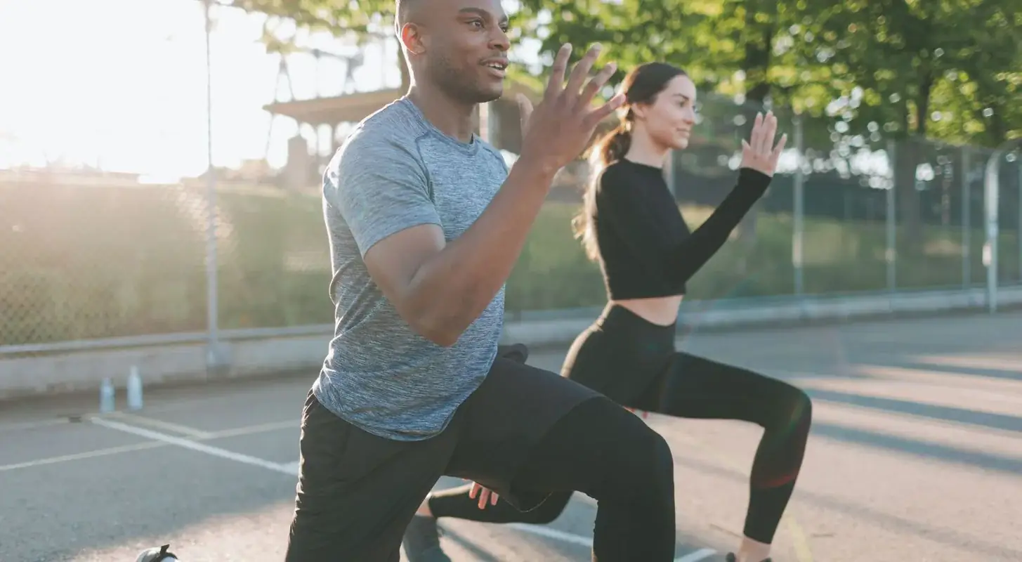 Two people working out outdoors