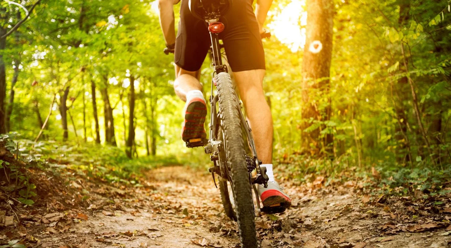 Man riding a mountain bike on a North Idaho trail